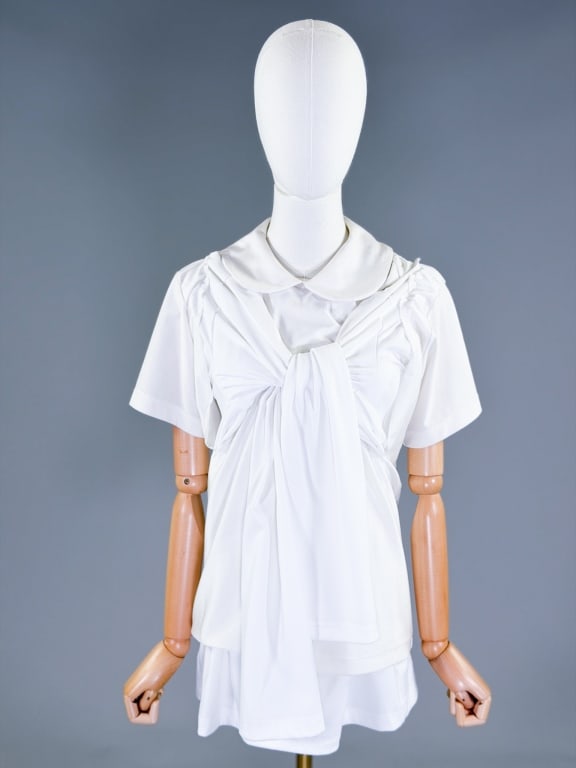 Comme Des Garcons 2018 White Knit Shirt Top: Comme Des Garcons 2018 White Knit Shirt Top having Peter Pan collar at neck with double layered body and long and short sleeve options. Labeled size Large. Measuring 36-44 inch bust, 28 inches long, 2