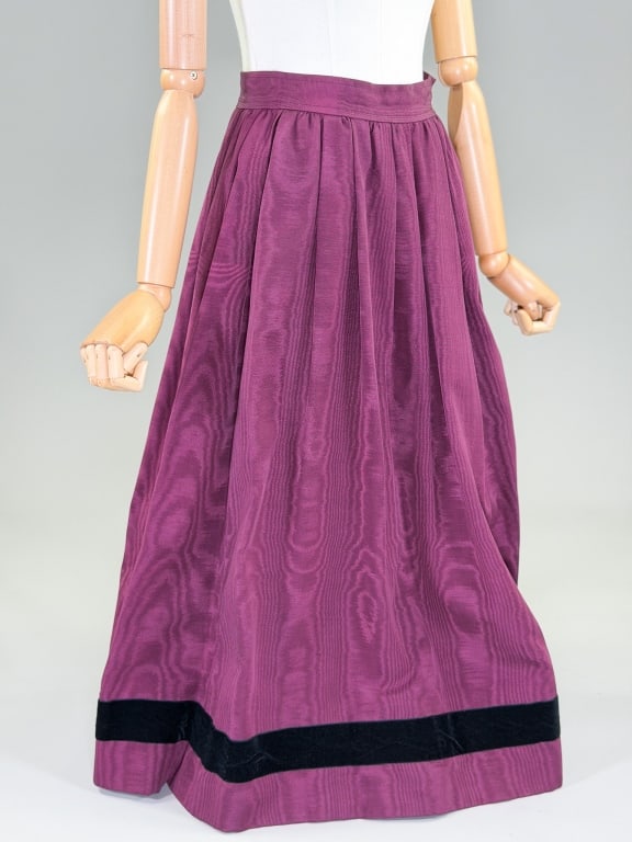 Vintage 1970s Yves Saint Laurent Moire Maxi Skirt: Vintage 1970s Yves Saint Laurent Moire Maxi Skirt having side zip closure with velvet ribbon detail at hem, fully lined. Labeled Saint Laurent Rive Gauche, marked size 34. Measuring 23 inch waist, 33 