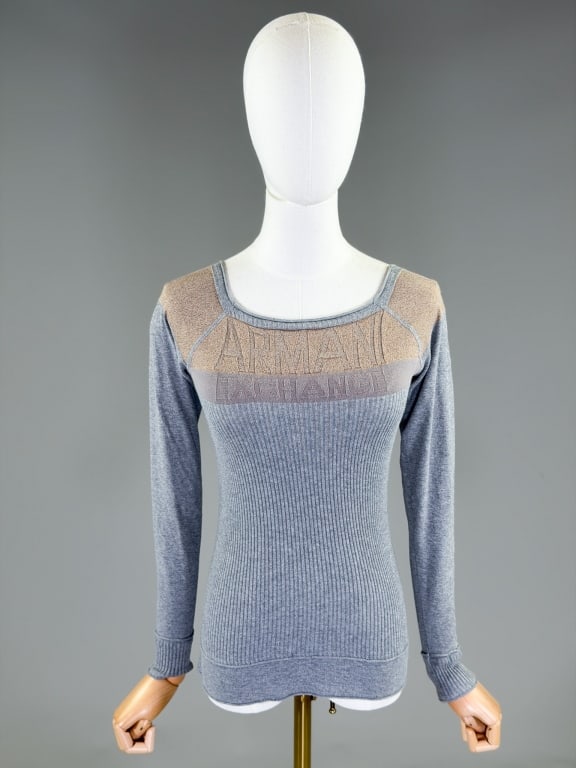 Vintage 2000s Armani Exchange Knit Shirt Top: Vintage 2000s Armani Exchange Knit Shirt Top having knit logo at front, ribbed through body. Measuring 26-38 inch bust, 20-42 waist, 22 inches long, 20 inch sleeve length. From the lifetime collection
