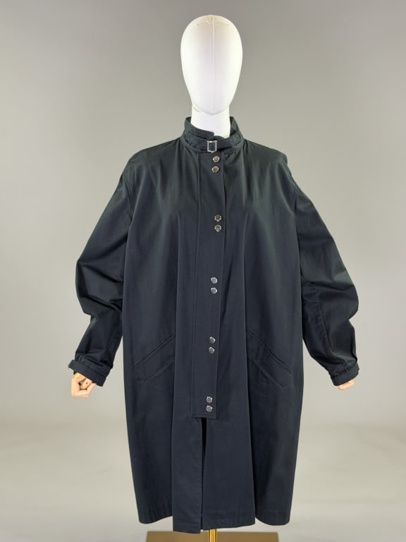 Vintage 2000s Emporio Armani Zip Front Trench Coat: Vintage 2000s Emporio Armani Zip Front Trench Coat having Mandarin collar with buckle, zip and snap front closure, and two front pockets, unlined throughout. Labeled Emporio Armani - marked size 48. M