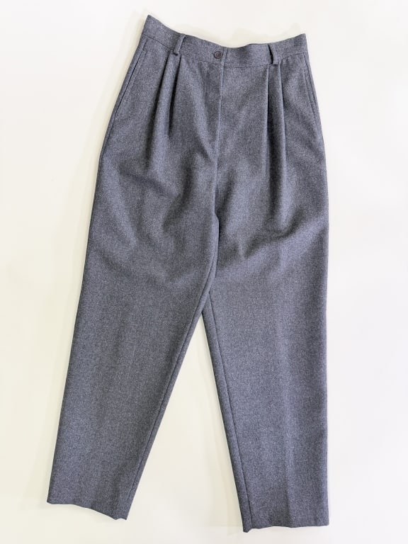 Vintage 1980s Valentino Wool Pleated Trousers: Vintage 1980s Valentino Wool Pleated Trousers having zip front closure with two side pockets, unlined. Labeled Valentino Miss V - marked size 42/8. Measuring 28 inch waist, 13 inch rise, 29 inch insea