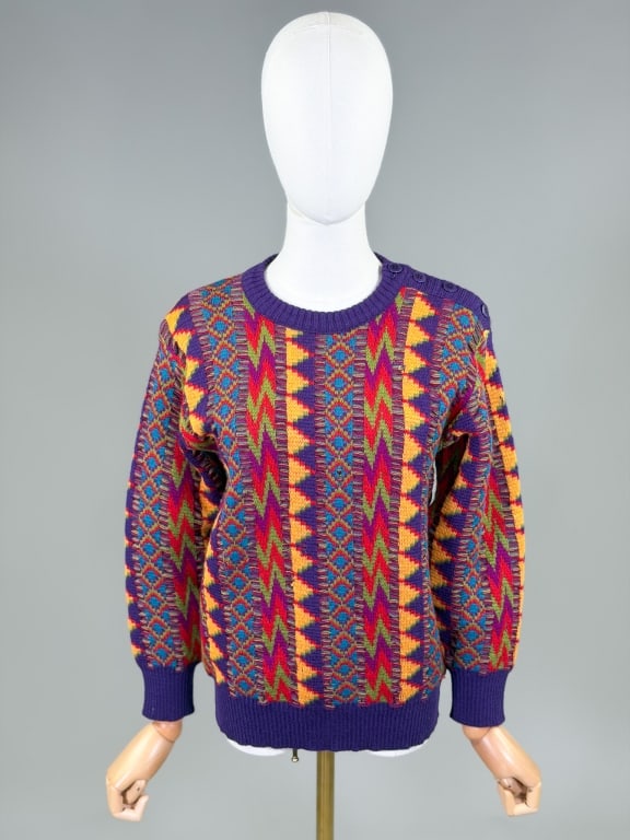 Vintage 1980s Yves Saint Laurent Knit Sweater Top: Vintage 1980s Yves Saint Laurent Knit Sweater Top having button closure at shoulder with stretch throughout. Labeled Saint Laurent Rive Gauche. Measuring 36-44 inch bust, 25 inches long, 20 inch sleev