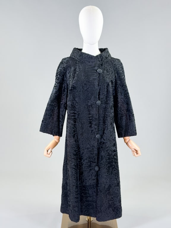Vintage 1950s Astrakhan Curly Lamb Fur Coat Jacket: Vintage 1950s Astrakhan Curly Lamb Fur Coat Jacket having button front closure. Measuring 42 inch bust, 43 inches long, 19 inch sleeve length. General wear as shown throughout. From the lifetime colle
