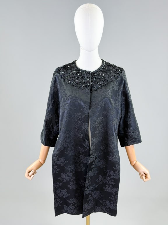 Vintage 1950s Floral Brocade Sequin Swing Coat: Vintage 1950s Floral Brocade Sequin Swing Coat having hook closure at neck. One size fits most. Measuring 34 inches long, 15 inch sleeve length. From the lifetime collection, fashion archive and busin