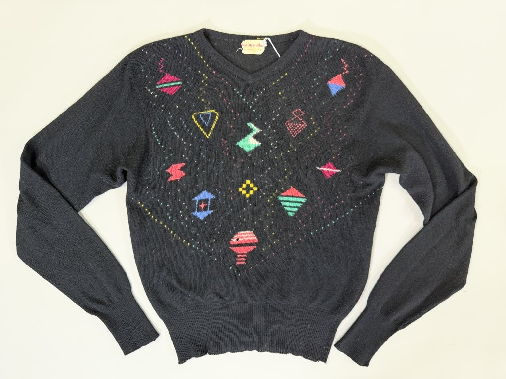 Vintage 1950s Cashmere Knit Novelty Sweater: Vintage 1950s Cashmere Knit Novelty Sweater having stretch throughout with graphic at front. Marked size 38. Measuring 36-38 inch bust, 23 inches long, 27 inch sleeve length. General wear as shown thr
