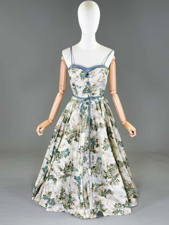 Vintage 1950s Floral Print Taffeta Party Dress: Vintage 1950s Floral Print Taffeta Party Dress having side zip closure with lace up front. Measuring 34 inch bust, 26 inch waist, 50 inches long. General wear as shown throughout. From the lifetime co