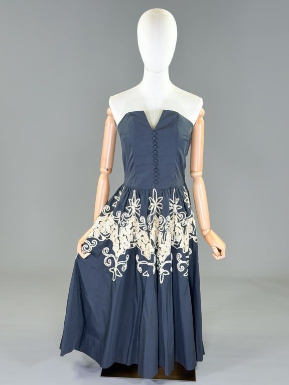 Vintage 1950s Cotton Soutache Strapless Dress: Vintage 1950s Cotton Soutache Strapless Dress having side zip closure and soutache details through skirt. Measuring 34 inch bust, 27 inch waist, 42 inches long. General wear as shown throughout. From 