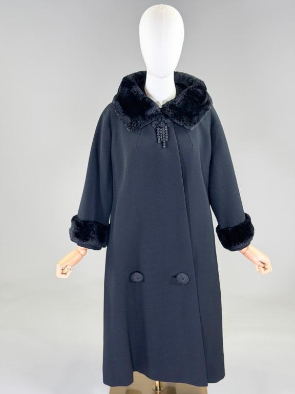 Vintage 1950's Fur Trimmed Wool Swing Coat: Vintage 1950's Fur Trimmed Wool Swing Coat having fur collar and cuff details with snap and button front closure, two front pockets and fully lined. Labeled Blum Bros. Measuring 48 inch bust, 41 inche