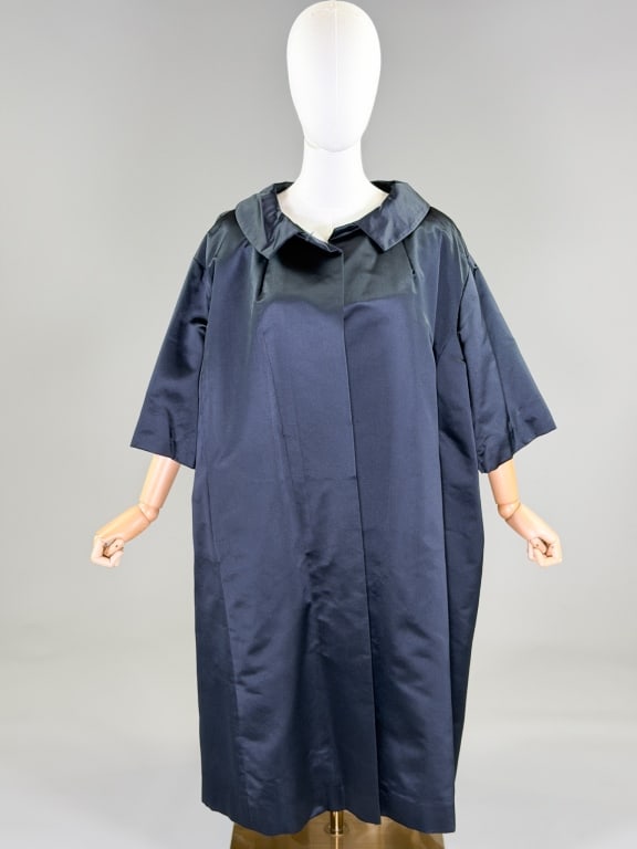Vintage 1950's Silk Satin Evening Swing Coat: Vintage 1950's Silk Satin Evening Swing Coat having collar at neck with open front and two front pockets, fully lined. Measuring one size fits most, 43 inches long, 13 inch sleeve length. From the lif