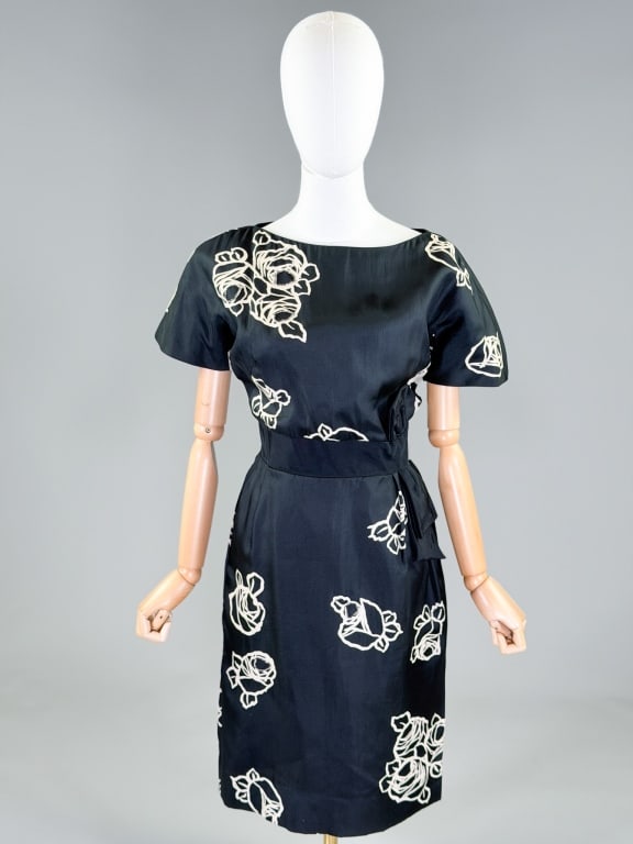 Vintage 1950's Silk Floral Beaded Dress: Vintage 1950's Silk Floral Beaded Dress having boat neckline with grosgrain bow ribbon waist and center back zip closure. Labeled Lillian Albus. Measuring 40 inch bust, 30 inch waist, 41 inches long, 