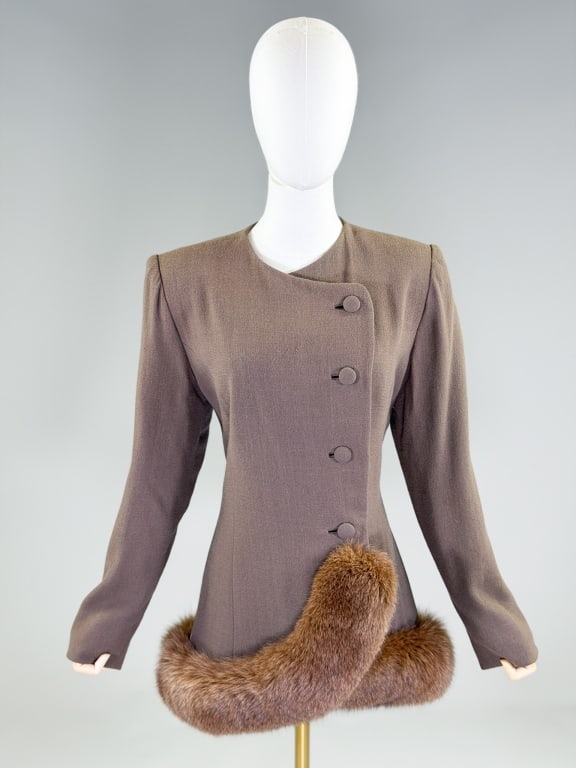 Vintage 1950s Travilla Wool Fox Fur Trim Jacket: Vintage 1950s Travilla Wool Fox Fur Trim Blazer Jacket having collarless neckline with button front closure and fox fur trimmed hem. Labeled Travilla. Measuring 38 inch bust, 36 inch waist, 30 inches 