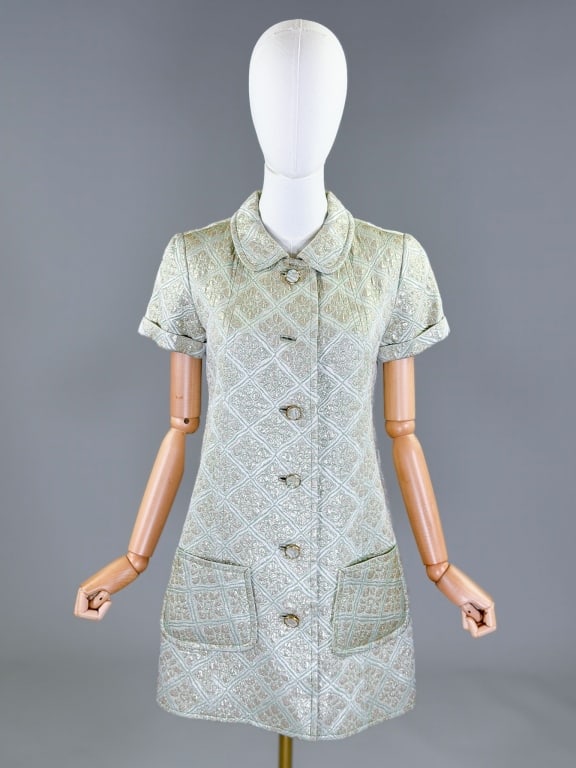 Vintage 1960s Mod A-Line Lame Woven Shift Dress: Vintage 1960s Mod A-Line Lame Woven Shift Dress having Peter Pan collar with button front closure and two front patch pockets, fully lined throughout. Measuring 36 inch bust, 36 inch waist, 33 inches 