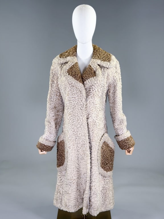 Vintage 1960s Ben Kahn Astrakhan Curly Lamb Coat: Vintage 1960s Ben Kahn Astrakhan Curly Lamb Coat having notched lapel collar with hook front closure and two front patch pockets, fully lined throughout. Measuring 38 inch bust, 34 inch waist, 42 inch