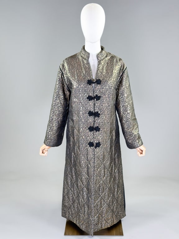 Vintage 1960s Gold Lame Floral Quilted House Coat: Vintage 1960s Gold Lame Floral Quilted House Coat having Mandarin collar at neck with frog closures up center front, fully lined. Measuring 40 inch bust, 46 inch waist, 20 inch sleeve length. From the
