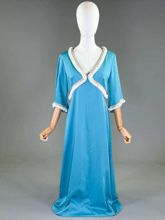 Vintage 1960s Beaded Maxi Hostess Dress: Vintage 1960s Beaded Maxi Hostess Dress having beaded details through bust and sleeves with center back zip closure. Measuring 38 inch bust, 32 inch waist, 50 inches long, 14 inch sleeve length. From 