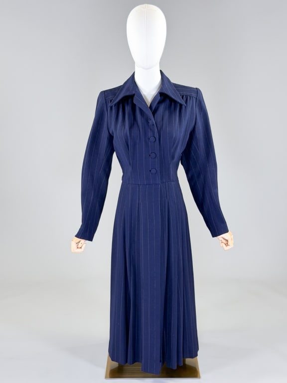Vintage 1970s Pinstripe Wool Shirt Dress: Vintage 1970s Pinstripe Wool Shirt Dress having dagger collar at neck with button front closure, side zip, and hook at waist. Measuring 38 inch bust, 30 inch waist, 46 inches long, 24 inch sleeve leng