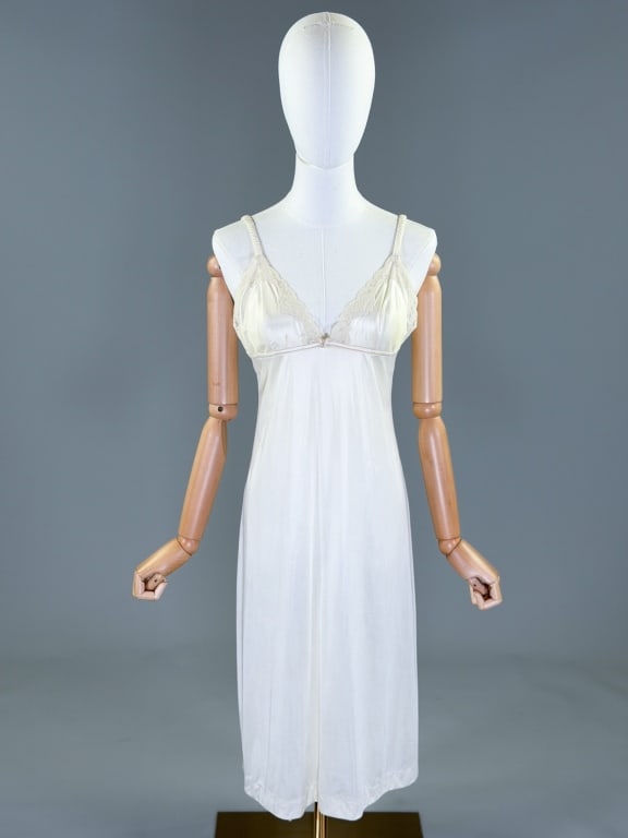 Vintage 1970s Papillon Nylon Knit Night Gown: Vintage 1970s Papillon Nylon Knit Night Gown Slip Dress having empire waistline with butterfly detail at front and lace details at bust. Labeled Papillon by Paula Carbone - marked size 32. Measuring 3