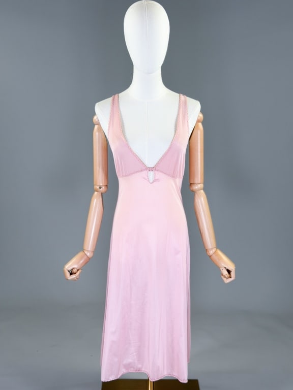 Vintage 1970s Nylon Knit Slip Dress Night Gown: Vintage 1970s Nylon Knit Slip Dress Night Gown having deep v-neckline with plastic closure at bust and stretch throughout. Labeled Kayser - marked size 32. Measuring 32 - 36 inch bust, 26 - 34 inch wa
