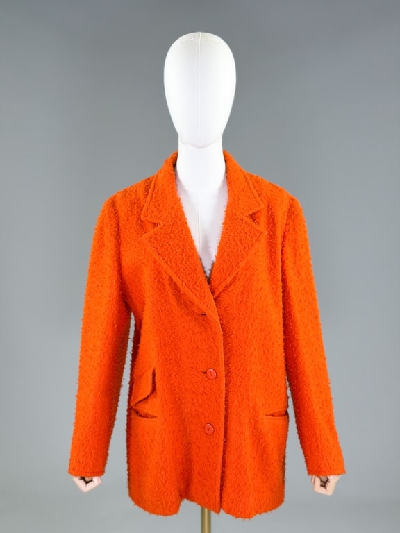Vintage 1970s Ritz Saddler Wool Blazer Jacket: Vintage 1970s Ritz Saddler Wool Blazer Jacket having notched lapel collar with single breasted button front closure and two front pockets. Labeled Ritz Saddler. Measuring 44 inch bust, 40 inch waist, 