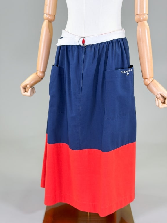 Vintage 1970s Courreges Paris Cotton Skirt: Vintage 1970s Courreges Paris Cotton Skirt having belt waist band and zip front closure with two front pockets. Labeled Hyperbole Courreges Paris. Measuring 30 inch waist, 28 inches long. From the lif