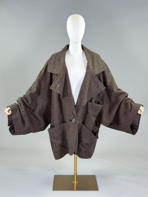 Vintage 1980s Jean-Charles de Castelbajac Coat: Vintage 1980s Jean-Charles de Castelbajac Brown Wool Oversize Cocoon Coat having notched lapel collar with single breasted button closure, three front pockets, one welt & two patch, fully lined throug