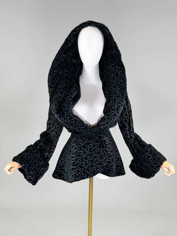 Vintage 1980s Norma Kamali Velvet Jacket Coat: Vintage 1980s Norma Kamali Velvet Jacket Coat having scribble design throughout with exaggerated shawl collar at neck, closing at center front with button and hook, fully lined throughout. Labeled Nor