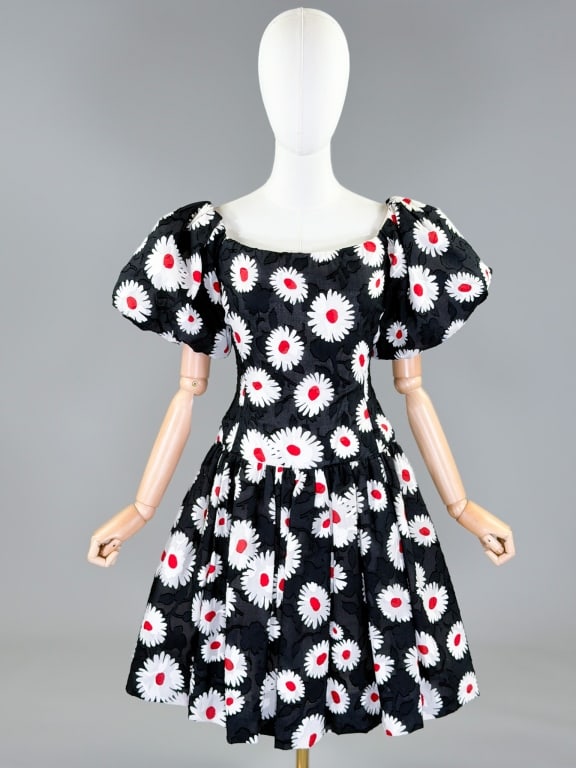 Vintage 1980s Arnold Scaasi Cotton Floral Dress: Vintage 1980s Arnold Scaasi Cotton Floral Party Dress having dramatic puffed sleeves, boned bodice, ruched skirt with crinoline, and center back zip closure. Fully lined throughout. Labeled Scaasi Bou