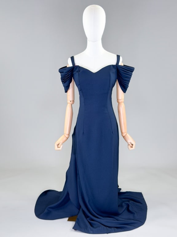 Vintage 1980s Off Shoulder Draped Evening Gown: Vintage 1980s Crepe Off Shoulder Draped Evening Gown having thin shoulder straps with off shoulder draped sleeves and draped detail at back with zip closure. Measuring 36 inch bust, 30 inch bust, 58 i