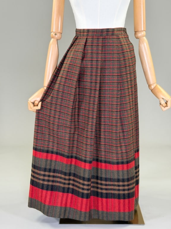 Vintage 1980s Plaid Wool Pleated Skirt: Vintage 1980s Breckenridge Plaid Wool Pleated Skirt having button closure at waist, fully lined throughout. Labeled Breckenridge. Measuring 24 - 25 inch waist, 33 inches long. From the lifetime collec