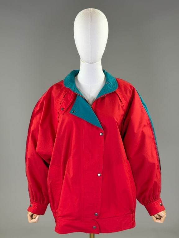 Vintage 1980s Two Tone Windbreaker Jacket Coat: Vintage 1980s Two Tone Zip Windbreaker Jacket Coat having zip front and button closure with zipper details at sleeves and elasticated waist. Measuring 52 inch chest, 42 - 50 inch waist, 29 inches long