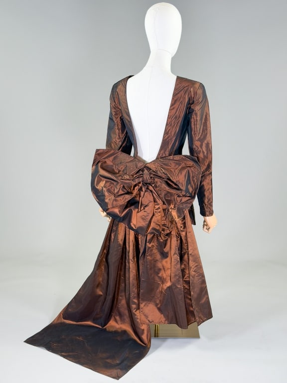 Vintage 1980s Taffeta Backless Party Dress: Vintage 1980s Taffeta Backless Party Dress having scooping low back with center back zip closure and draped details at waist. Measuring 36 inch bust, 28 inch waist, 42 inches long, 23 inch sleeve leng