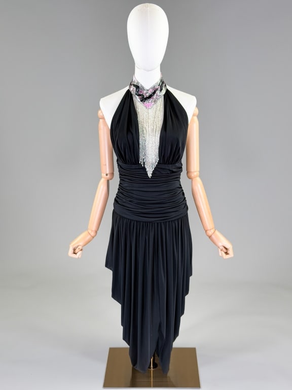 Vintage 1980s Casadei Beaded Fringe Jersey Dress: Vintage 1980s Casadei Beaded Fringe Jersey Dress having beaded fringe detail at neck with ruched draped details through body, closing at back with zip and hooks at neck. Labeled Casadei - dated 1982. 
