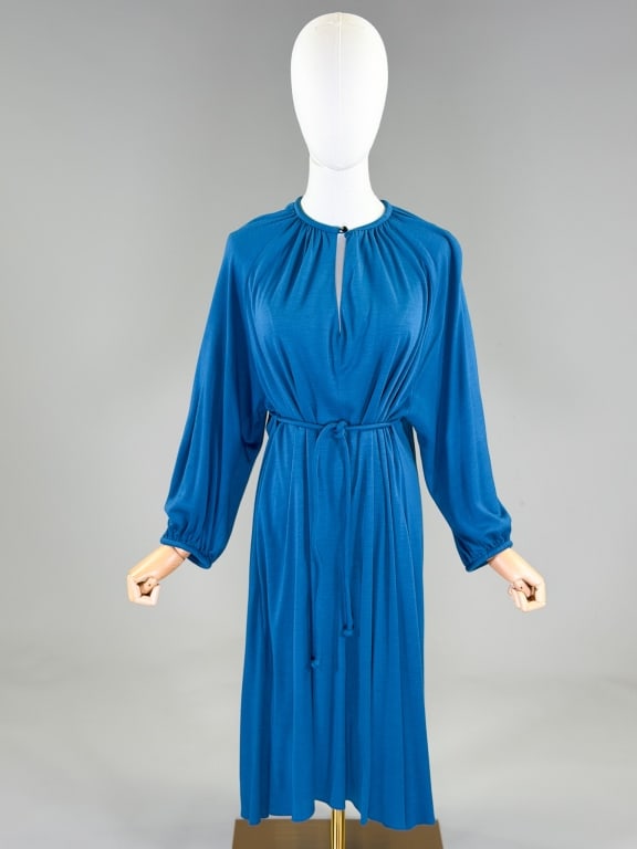 Vintage 1980s Rene Helga Howie Jersey Knit Dress: Vintage 1980s Rene Helga Howie Jersey Knit Dress having single button closure at neck and belt at waist with stretch throughout. Measuring free bust and waist, 42 inches long, 20 inch sleeve length. F