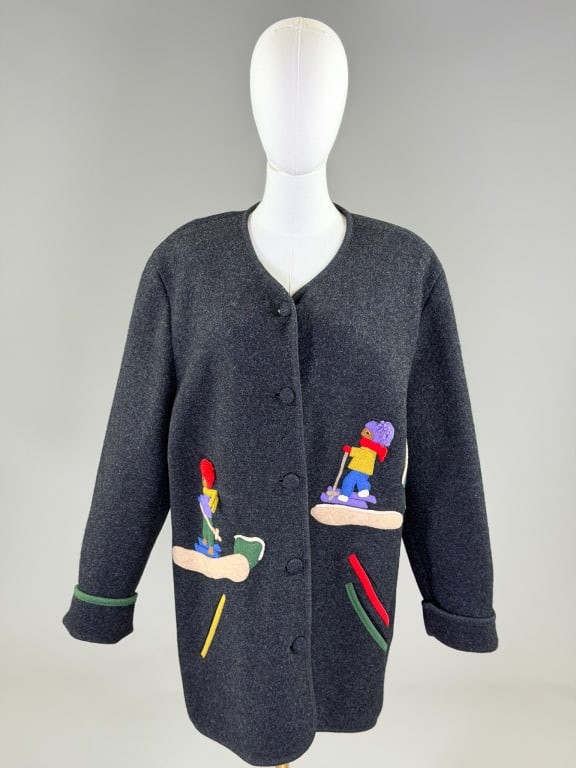 Vintage 1980s Wool Knit Ski Applique Jacket: Vintage 1980s Wool Knit Ski Applique Jacket having button front closure and ski theme appliques at front. Labeled Yessica. Measuring 48 inch bust, 34 inches long, 29 inch sleeve length. From the lifet