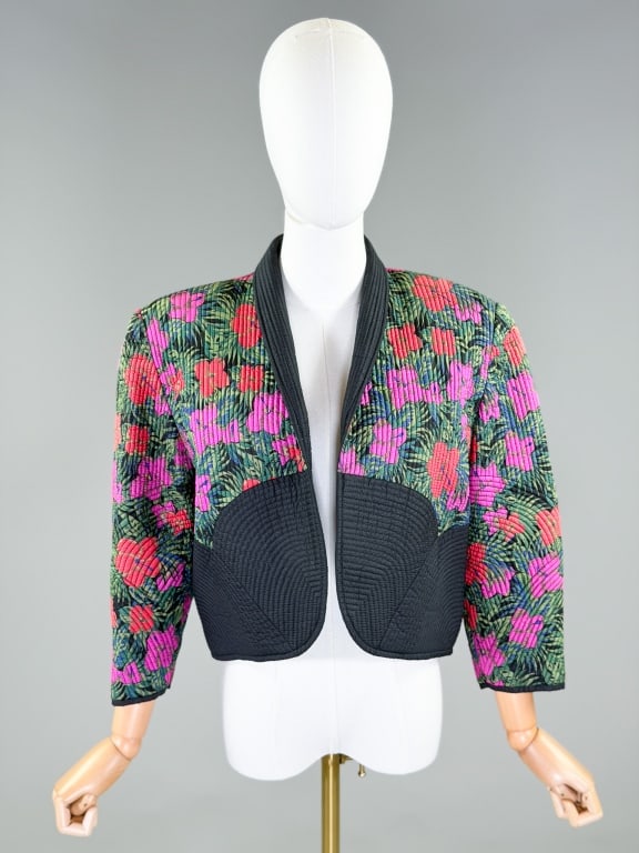 Vintage 1980s Floral Silk Quilted Bolero Jacket: Vintage 1980s Floral Silk Quilted Bolero Jacket having shawl collar and open front. Labeled Thai Silk, marked size Large. Measuring 19 inches long, 19 inch sleeve length. From the lifetime