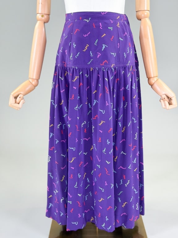 Vintage 1980s Silk Scribble Print Yoke Skirt: Vintage 1980s Silk Scribble Print Yoke Skirt having side zip closure, yoke at waist with ruched skirt. Measuring 26 inch waist, 31 inches long. From the lifetime collection, fashion archive and
