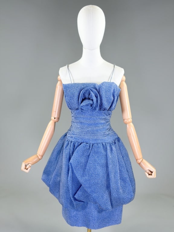 Vintage 1980s Tally Boutique Printed Bubble Dress: Vintage 1980s Tally Boutique Printed Bubble Dress having rosette detail at bust with ruched body and bubble skirt, closing at center back with zipper. Labeled Tally Boutique New York. Measuring 34