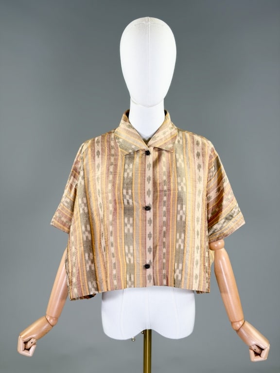 Vintage 1980s Callaghan Silk Ikat Print Blouse: Vintage 1980s Callaghan Silk Ikat Print Blouse having collar at neck with button front closure. Labeled Callaghan, Made in Italy. Measuring free bust and waist, 18 inches long, 9 inch sleeve length. F