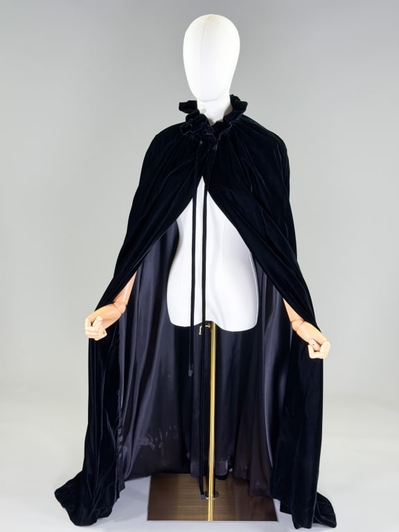 Vintage 1980s Anthony Muto Velvet Cape Cloak: Vintage 1980s Anthony Muto Velvet Cape Cloak having ruffled collar with tie and hook closures at neck, fully lined. Labeled Anthony Muto AM/PM. Measuring one size fits most, 50 inches long. From the