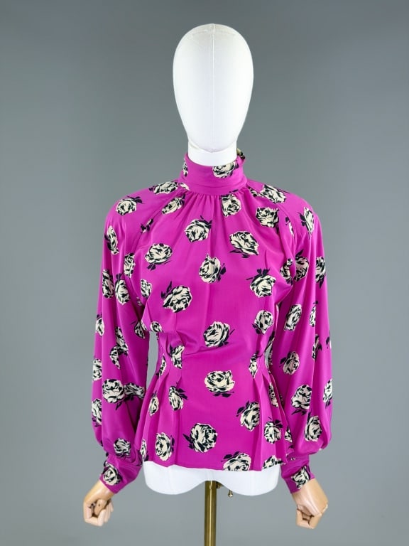 Vintage 1980s Emanuel Ungaro Silk Floral Blouse: Vintage 1980s Emanuel Ungaro Silk Floral Blouse having button back closure with darted waist and bishop sleeves. Labeled Ungaro Ter, marked size 38/4. Measuring 40 inch bust, 28 inch waist, 24 inches 