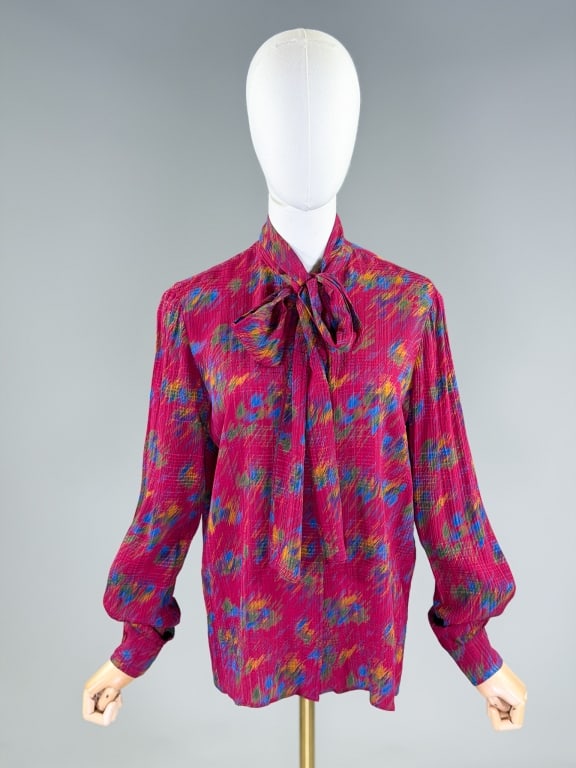 Vintage 1980s Koos Van Den Akker Silk Blouse: Vintage 1980s Koos Van Den Akker Silk Blouse having plaid print throughout with covered placket button front closure and pussy bow-tie at neck. Labeled Koos koos Van Den Akker. Measuring 42 inch bust,