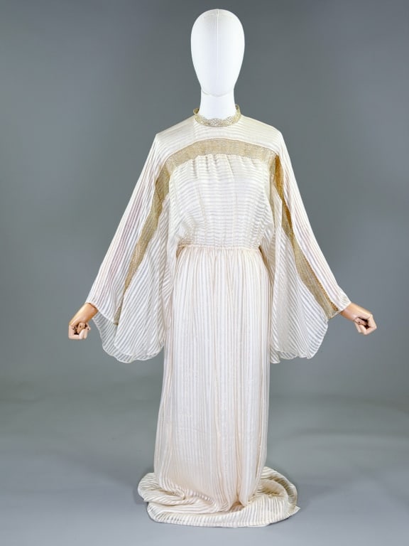 Vintage 1980s Silk Farm Metallic Caftan Dress: Vintage 1980s Silk Farm Metallic Caftan Dress having gold metallic lace details throughout with elastic waist and button closure at back neck. Labeled The Silk Farm, Designed by Icino. Marked size 10.