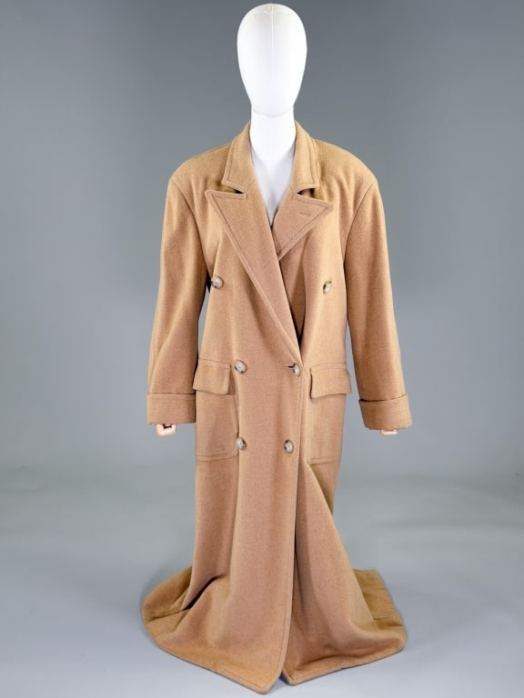Vintage 1990s Ralph Lauren Wool Camel Hair Coat: Vintage 1990s Ralph Lauren Wool Camel Hair Coat having notched lapel collar with double breasted button front closure and two front patch pockets. Labeled Ralph Lauren. Marked size 6. Measuring 44
