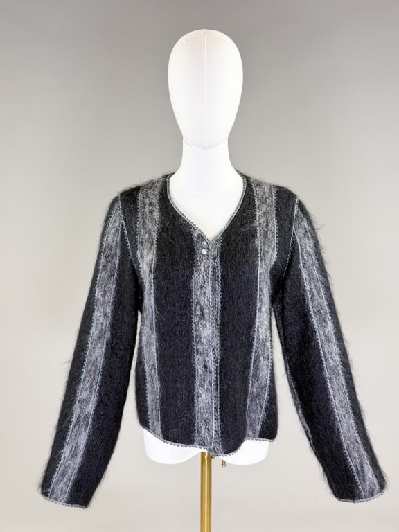 Vintage 1990s Geoffrey Beene Cardigan Sweater: Vintage 1990s Geoffrey Beene Cardigan Sweater having collarless neckline with button front closure. Labeled Geoffrey Beene, marked size 10. Measuring 38 inch bust, 22 inches long, 25 inch sleeve lengt