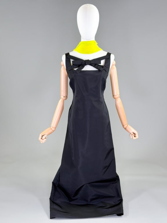 Vintage 1990s Lee Anderson Couture Column Gown: Vintage 1990s Lee Anderson Couture Column Gown having bow detail at front with center back zip closure. Labeled Lee Anderson Couture, marked size Petite. Measuring 36 inch bust, 33 inch waist, 55 inch