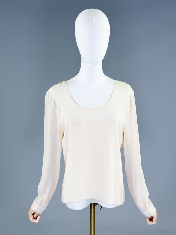 Vintage 1990s Silk Chiffon Scoop Neck Blouse Top: Vintage 1990s Silk Chiffon Scoop Neck Blouse Top having scoop neck with side zip closure. Labeled Genny, marked size 44. Measuring 38 inch bust, 23 inches long, 24 inch sleeve length. From the lifetim