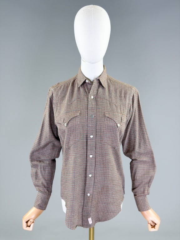 Vintage 1990s Ralph Lauren Western Shirt Top: Vintage 1990s Ralph Lauren Western Shirt Top having snap front closure with western details throughout. Labeled Ralph Lauren Western Wear, marked size 8. Measuring 38 inch bust, 27 inches long, 23 inc