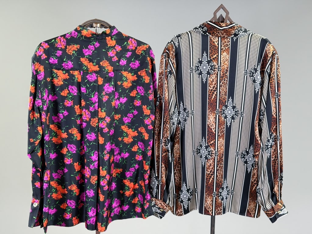 Two Vintage 1990s Escada Silk Printed Blouses Tops: Two Vintage 1990s Escada Silk Printed Blouses Tops. One labeled Margeritha Ley. Measuring 42 inch bust, 27 inches long, 24 inch sleeve length. One labeled Escada. Measuring 40 inch bust, 27 inches lon