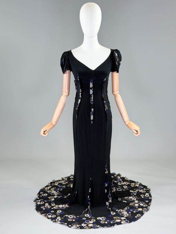 Vintage 2000s Emanuel Ungaro Silk Chiffon Dress: Vintage 2000s Emanuel Ungaro Silk Chiffon Dress having v-neckline, umpire waist line, short cap sleeves, printed chiffon godets at hem, and center back zip closure. Labeled Emanuel Ungaro Paris - mark