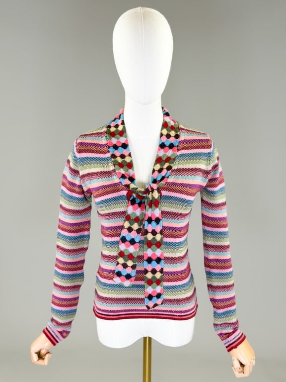 Vintage 2000s Cacharel Rainbow Knit Sweater Top: Vintage 2000s Cacharel Rainbow Wool Knit Sweater Top having tie at neck with stretch throughout. Labeled Cacharel. Measuring 34 - 40 inch bust, 21 inches long, 24 inch sleeve length. General wear, pil